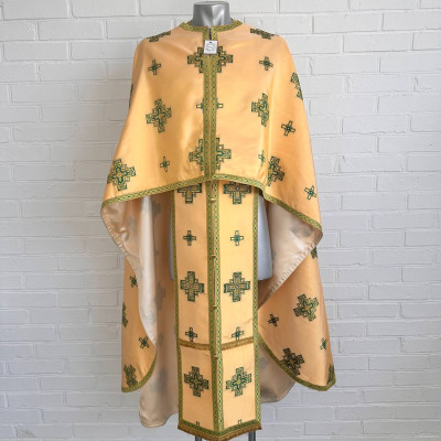 The priest's vestment is yellow, Greek cut, with green and yellow embroidery