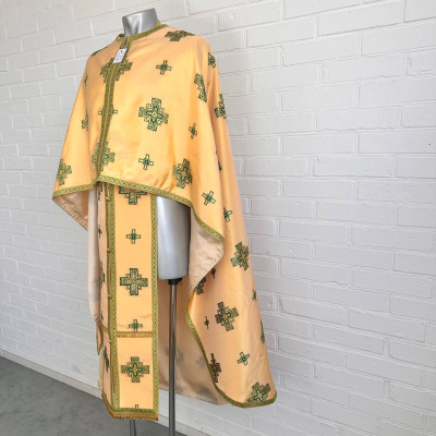 The priest's vestment is yellow, Greek cut, with green and yellow embroidery