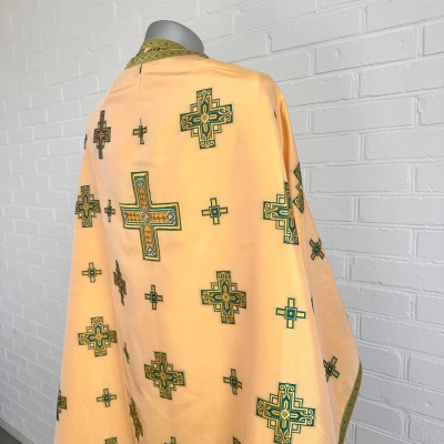 The priest's vestment is yellow, Greek cut, with green and yellow embroidery