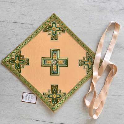 The priest's vestment is yellow, Greek cut, with green and yellow embroidery