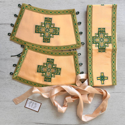 The priest's vestment is yellow, Greek cut, with green and yellow embroidery