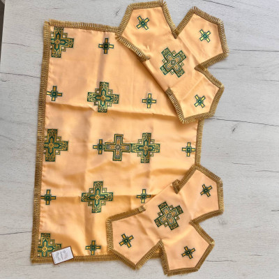 The priest's vestment is yellow, Greek cut, with green and yellow embroidery