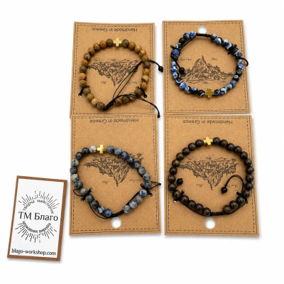 Orthodox Greek amulet bracelet on the hand made of natural stone with a cross